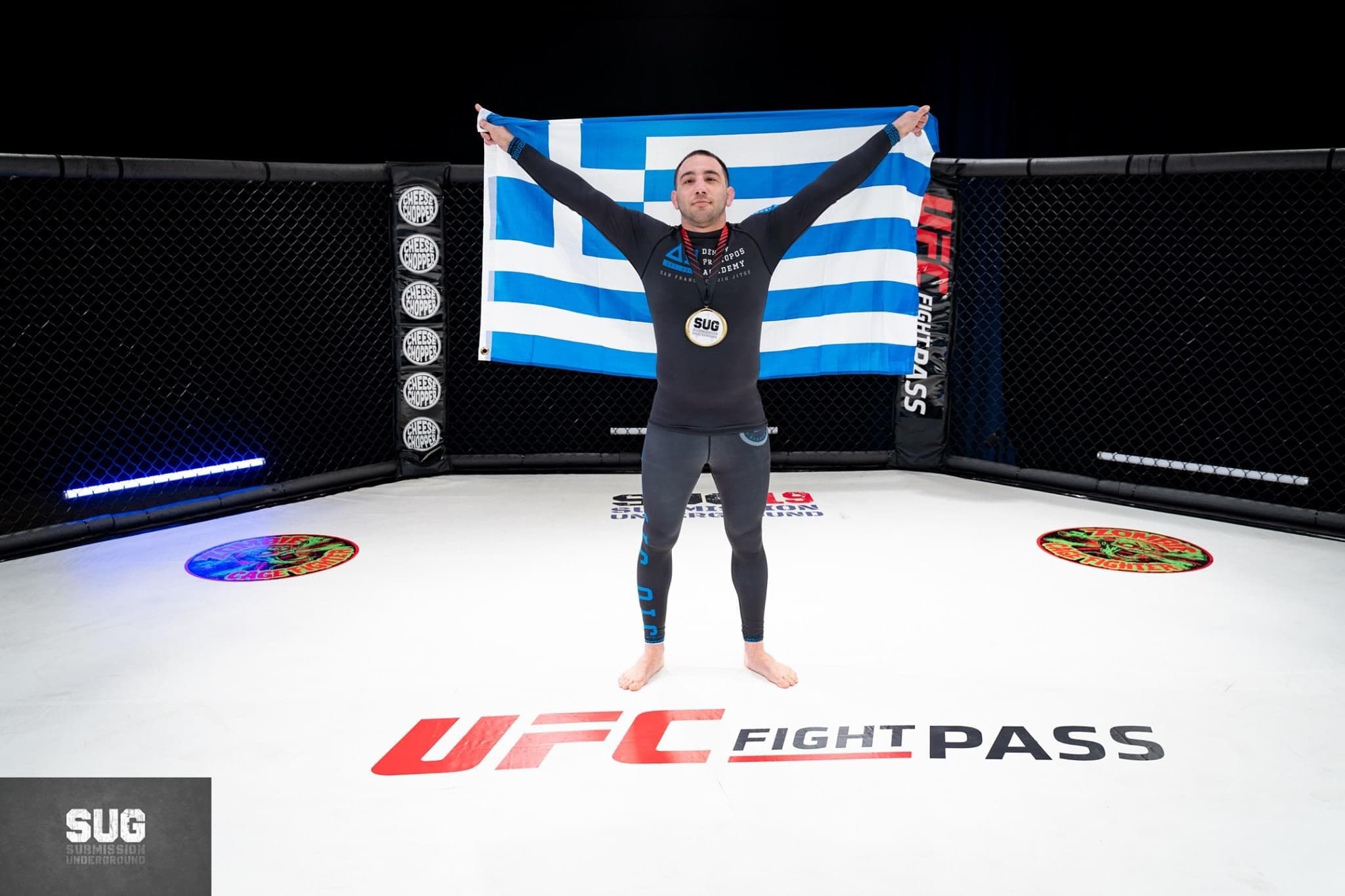 Denny Prokopos holding a flag after competition